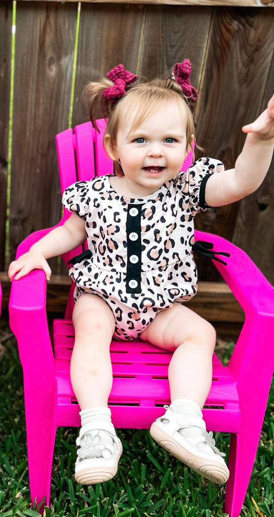 Leopard romper with bows