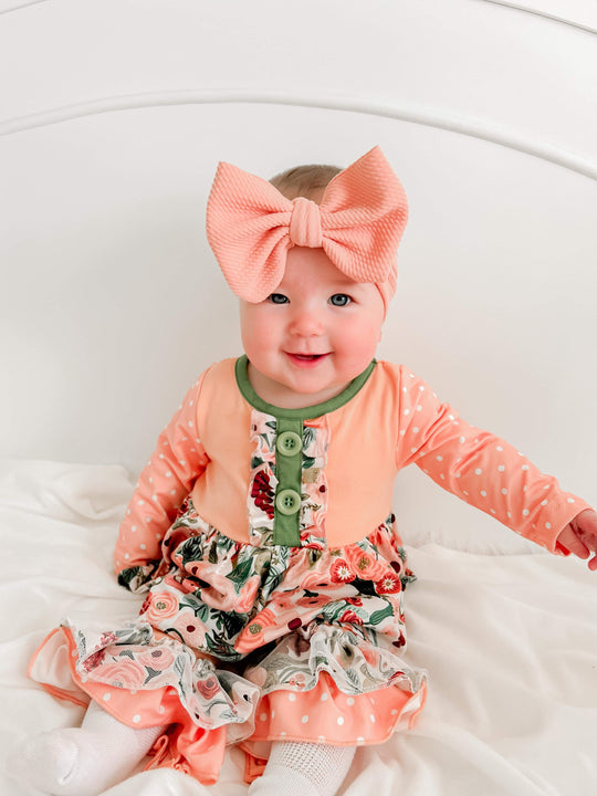 Coral and green floral skirted romper