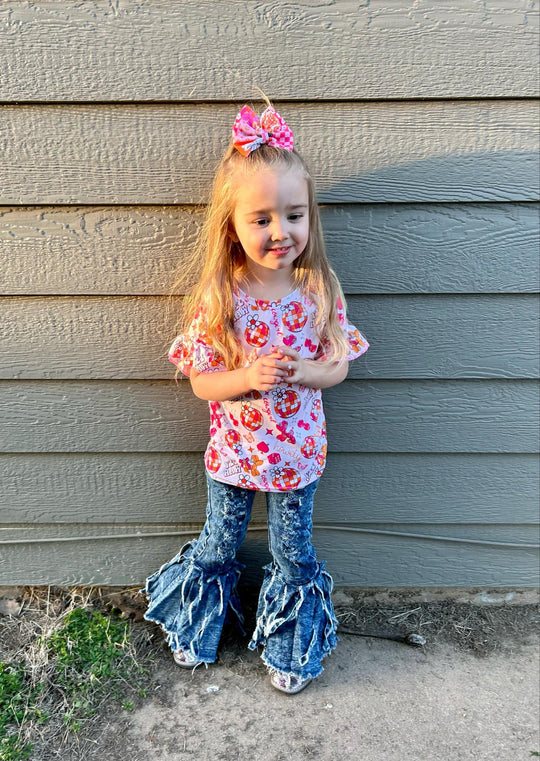 Distressed denim fringe jeans