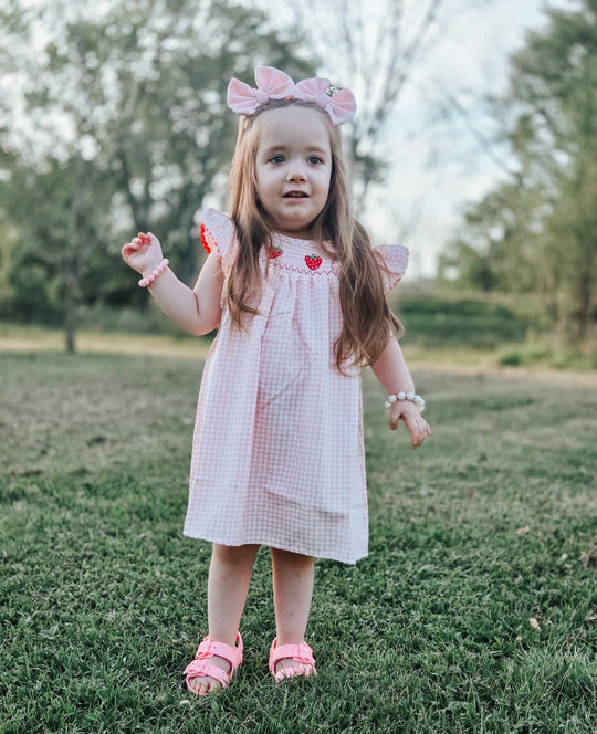 Pink plaid smocked strawberry dress