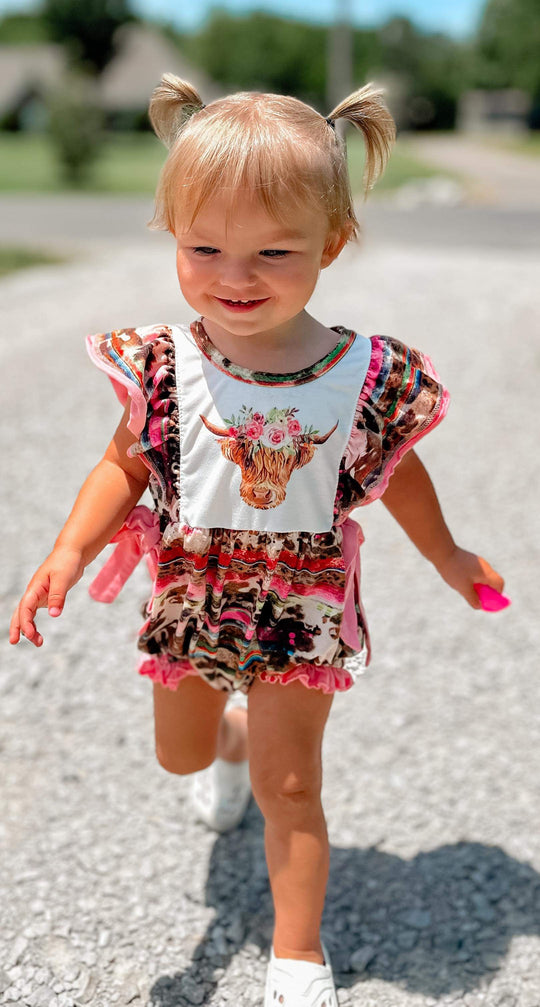 Pink serape cow romper