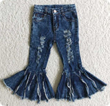 Distressed denim fringe jeans