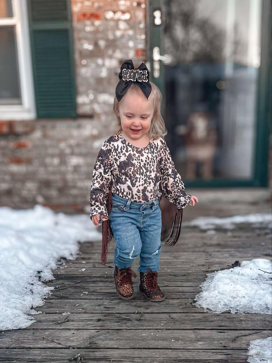 Brown cowhide fringe leo