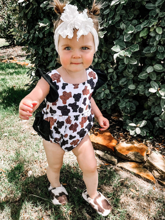Glitter cow insp ruffle romper