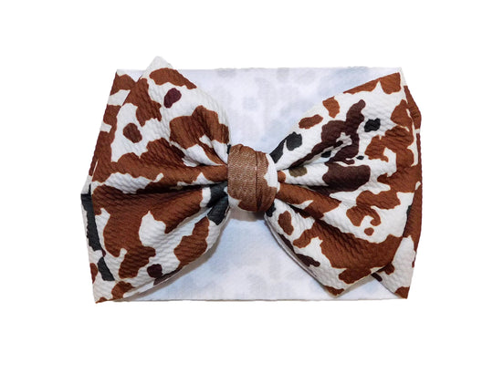 Brown cow spots bow