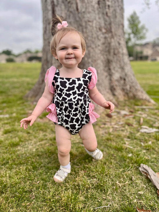 Black cow spots & pink romper