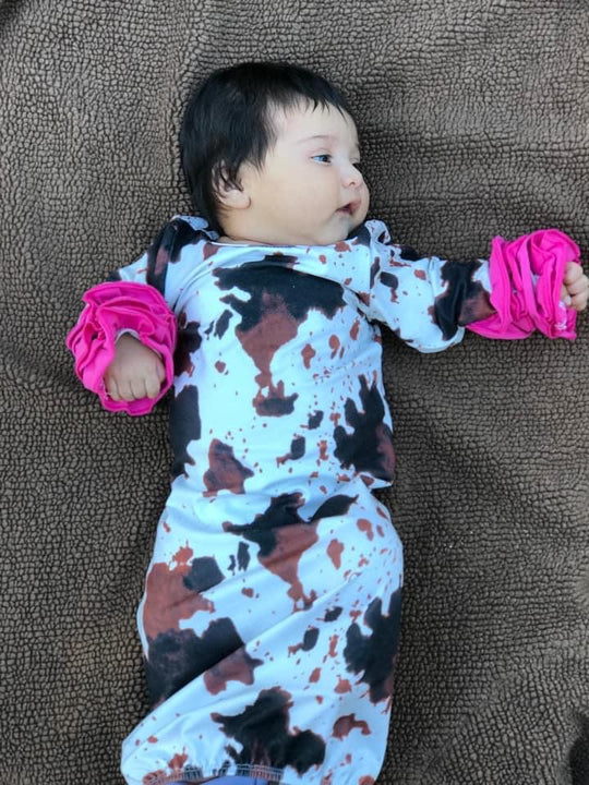 Cow print gown with pink ruffles