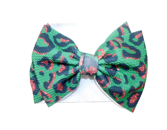 Green and red leopard bow