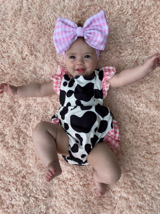 Pink cow ruffle romper