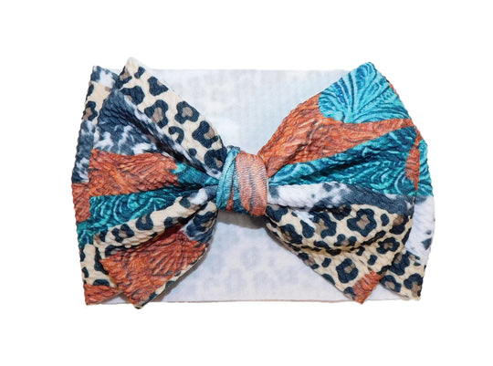 Leopard and tooled leather brush strokes