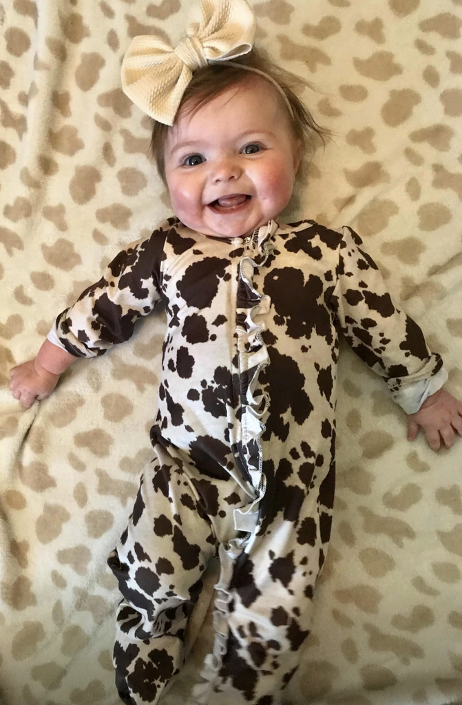 Brown cow spots footie sleeper with ruffle