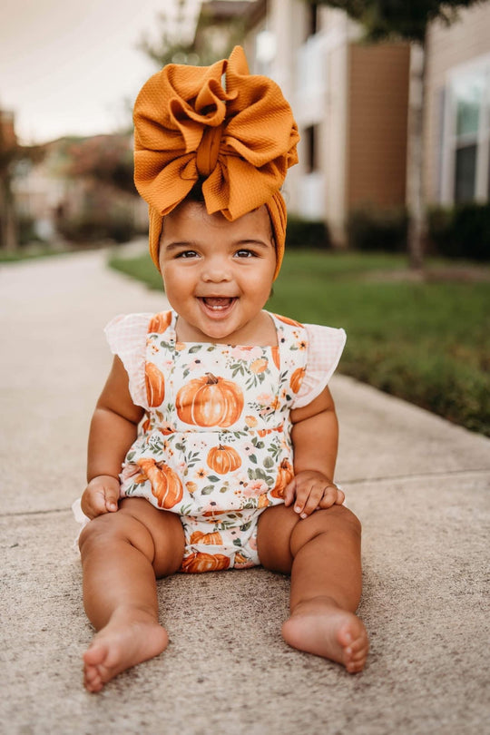 Floral pumpkin ruffle romper
